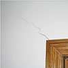 wall cracks along a doorway in a Troy home.