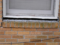 A window sill cracking and separating from the foundation wall in a Saint Clair Shores home.
