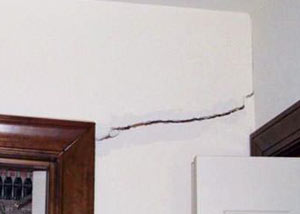 A large drywall crack in an interior wall in Flint
