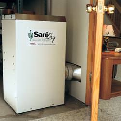 A basement dehumidifier with an ENERGY STAR® rating ducting dry air into a finished area of the basement  in Lincoln Park