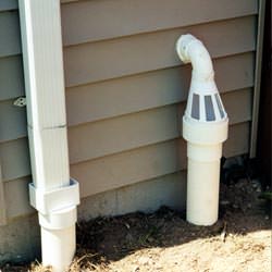 A grated sump pump discharge line fitting in Royal Oak