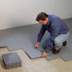 basement subfloor tiles being installed by a contractor in Redford