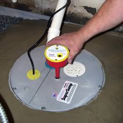 A newly installed sump pump system in a basement in Saint Clair Shores