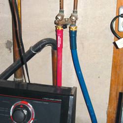 Washer hoses in a basement  in Madison Heights